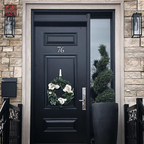 Black steel entry door with custom panels