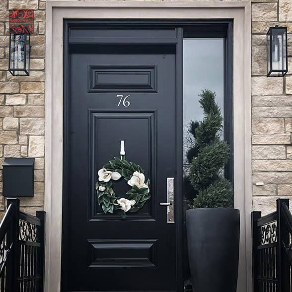 Black steel entry door with custom panels