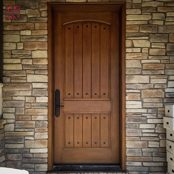 Fiberglass door with decorative nails