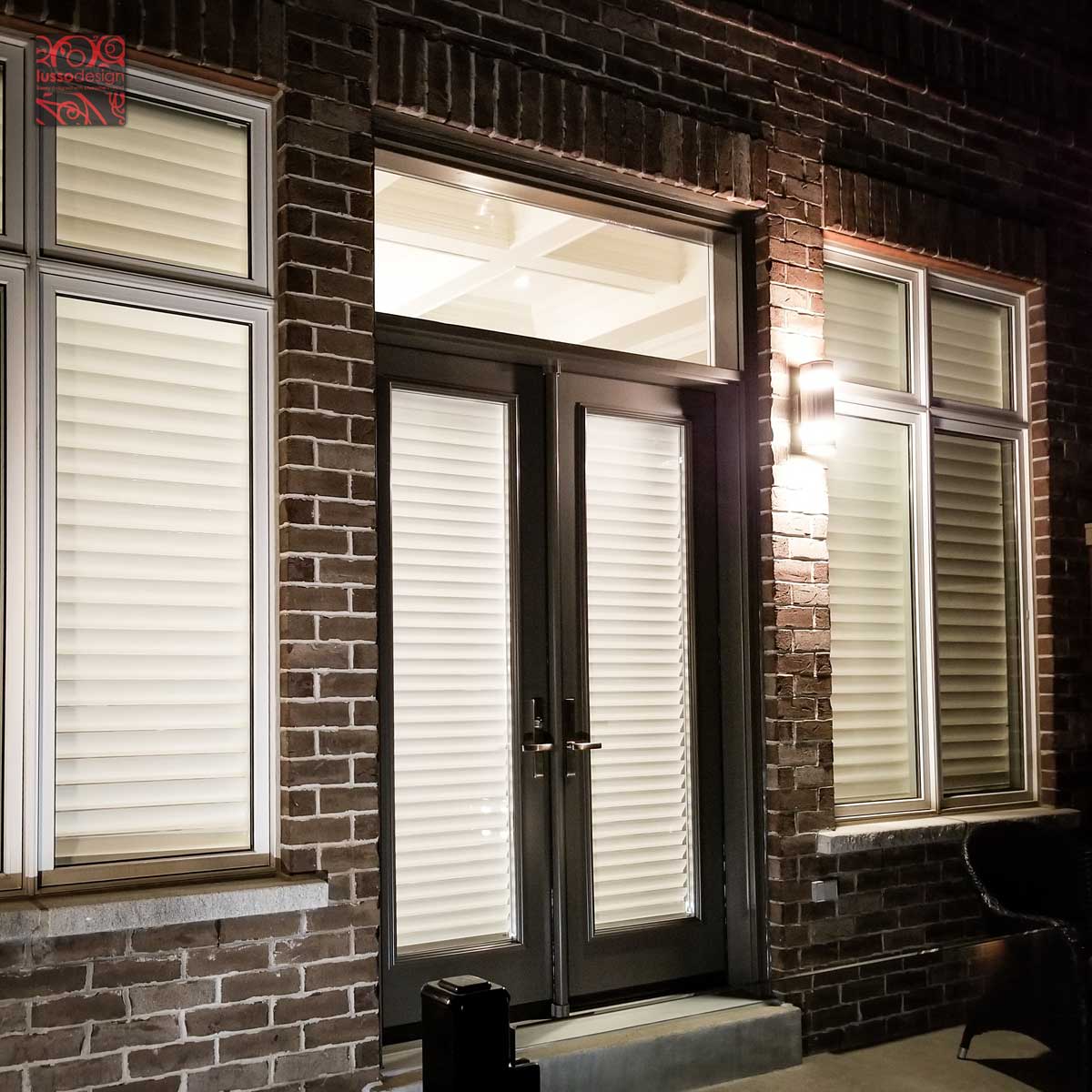 Simple steel double door with transom and clear glass